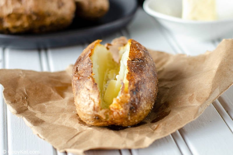 air fryer baked potato topped with butter