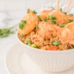air fryer bang bang shrimp with sauce and chopsticks in a bowl