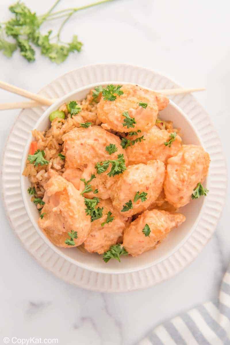 overhead view of bang bang shrimp, sauce, and rice in a bowl