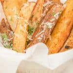 air fryer seasoned potato wedges in a serving dish