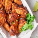 overhead view of air fryer sweet and spicy chicken wings in a serving dish