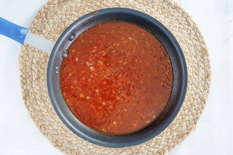 homemade barbeque sauce for baked hot dogs in a skillet