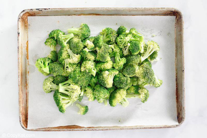 lightly steamed broccoli florets on a baking sheet