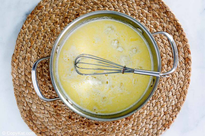 butter, cream, and parmesan cheese in a saucepan
