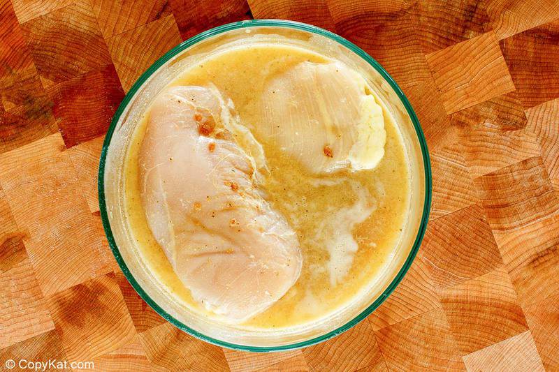 chicken breasts and marinade in a bowl