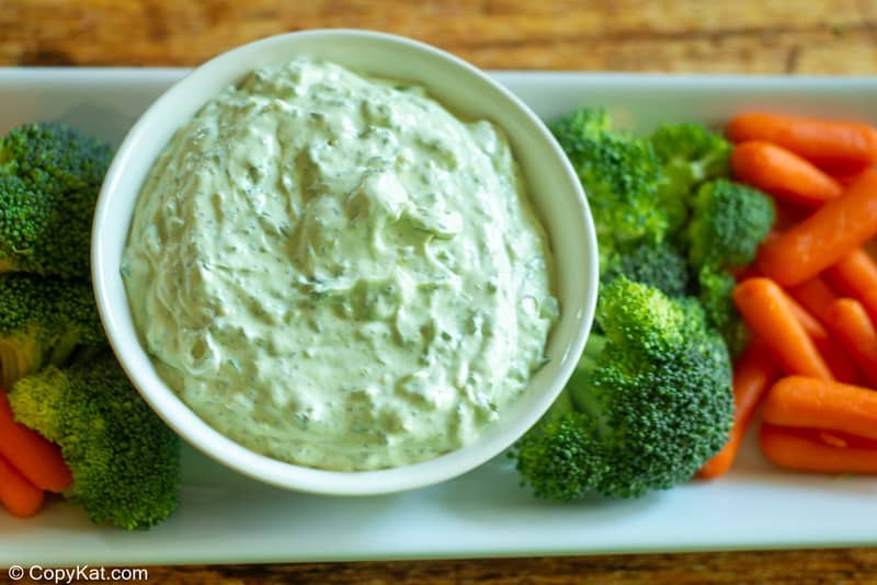 green goddess dip in a bowl, broccoli, and carrots