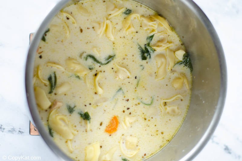creamy chicken tortellini soup in an Instant Pot bowl