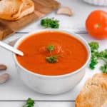 tomato soup and a spoon in a bowl