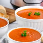 bowls of tomato soup in front of an Instant Pot