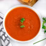Instant Pot tomato soup, a napkin, and toasted bread slices