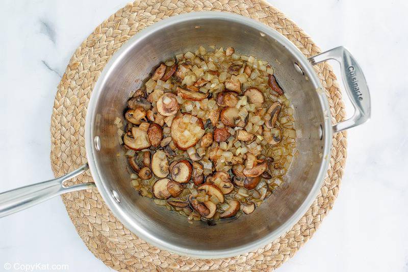 sauteed mushrooms and onions in a saucepan