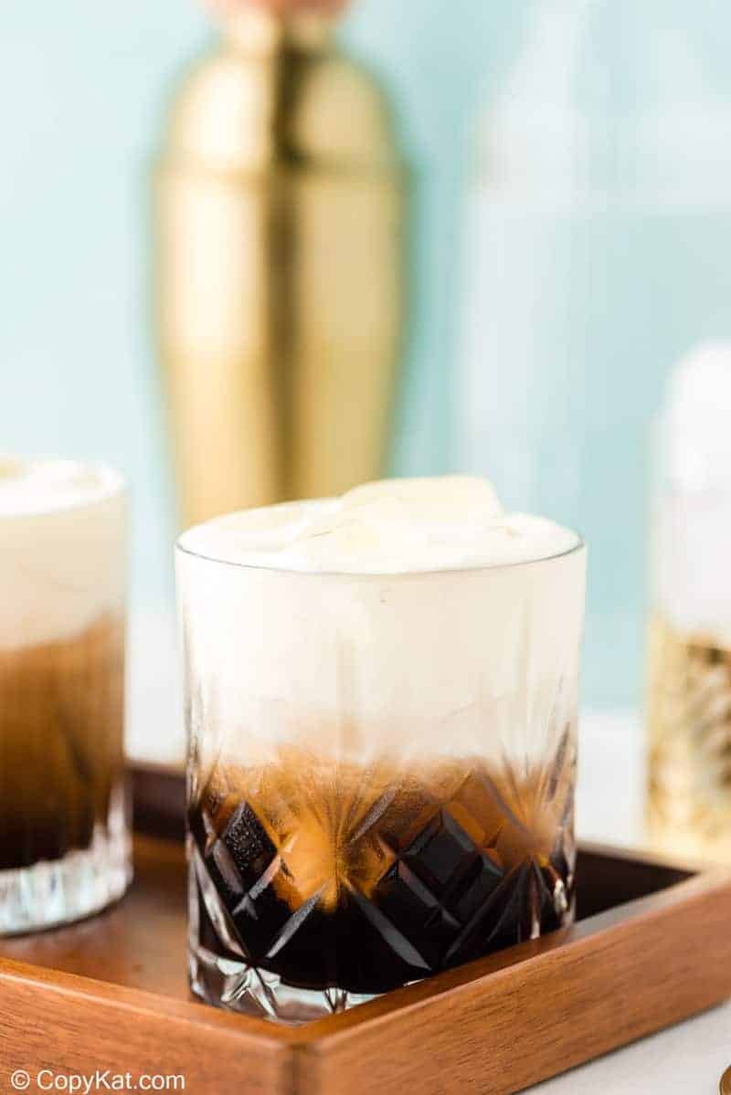 White Russian drink on a serving tray