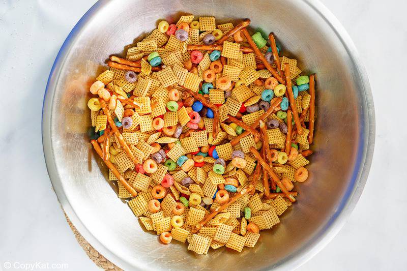 Cereal, pretzel, peanut, and candy mixture for white trash candy snack