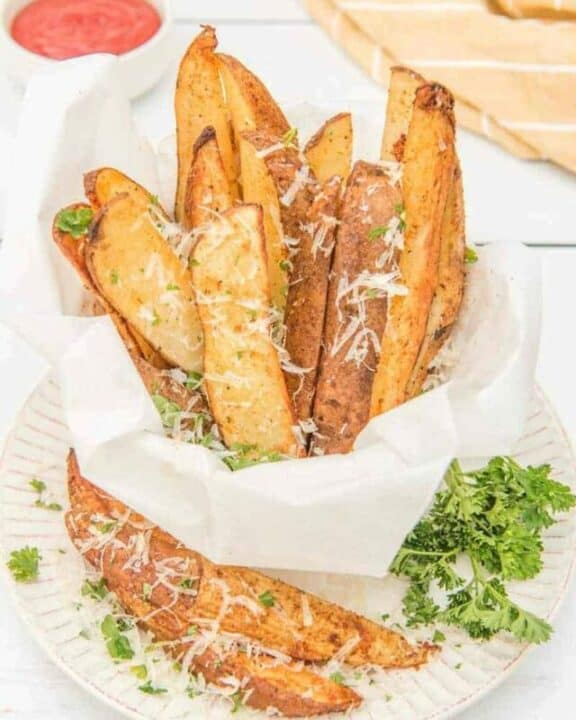air fried potato wedges sprinkled with parmesan cheese and parsley