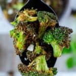 closeup photo of air fryer broccoli on a spoon