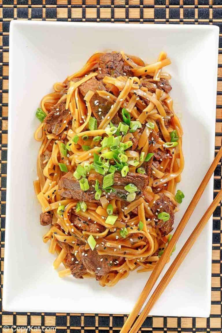 overhead view of beef chow fun on a platter