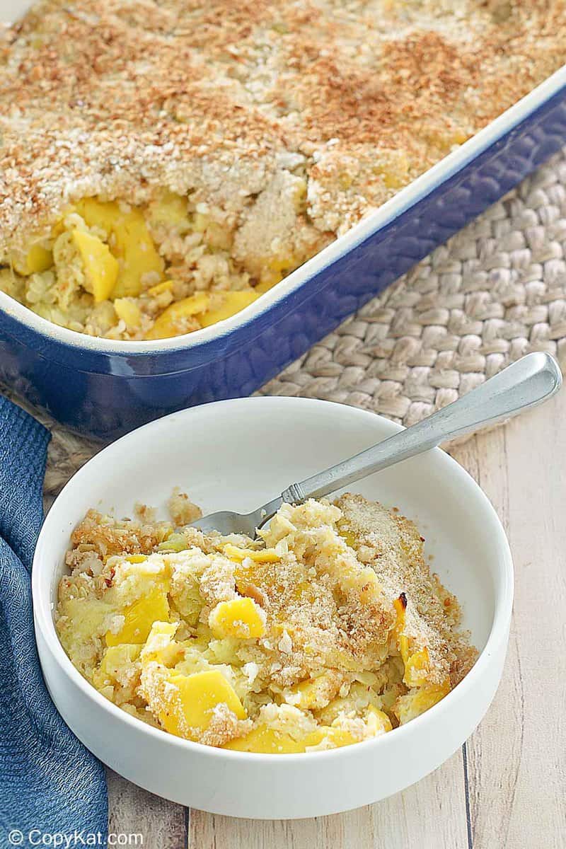 yellow squash casserole in a bowl and baking dish