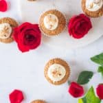 overhead view of carrot cake cupcakes and roses