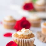 carrot cake cupcake with cream cheese frosting and rose petals