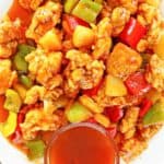 overhead view of sweet and sour chicken with homemade sauce
