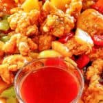 sweet and sour chicken and a bowl of homemade sweet and sour sauce