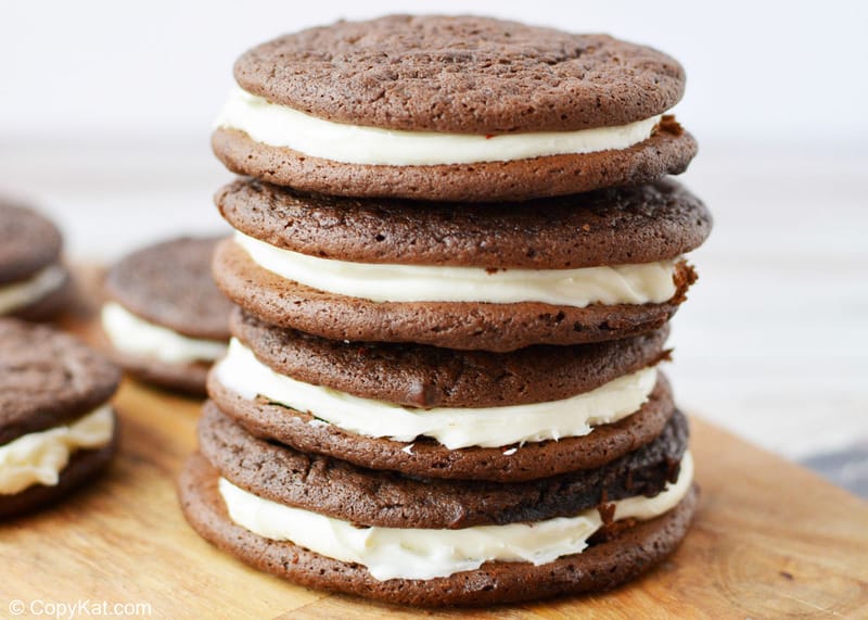 chocolate sandwich cookies on a wood board