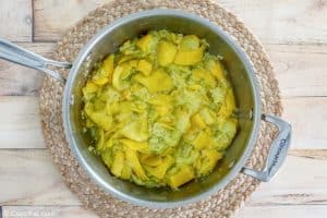 cooked yellow squash in a saucepan