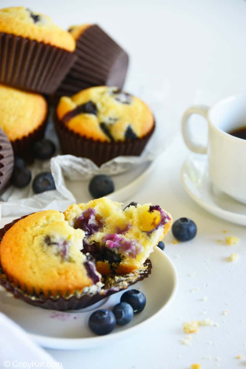 split open blueberry muffin on a plate