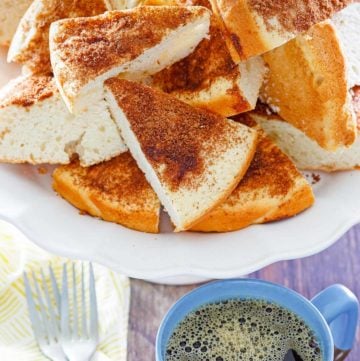 slices of old fashioned coffee cake, two forks, and a cup of coffee