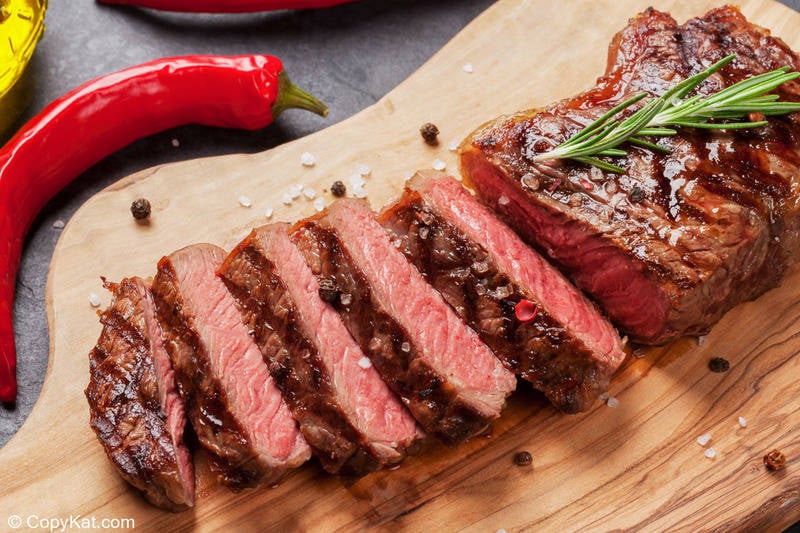 sirloin steak slices on a cutting board