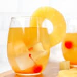 pineapple white wine sangria garnished with fresh pineapple ring