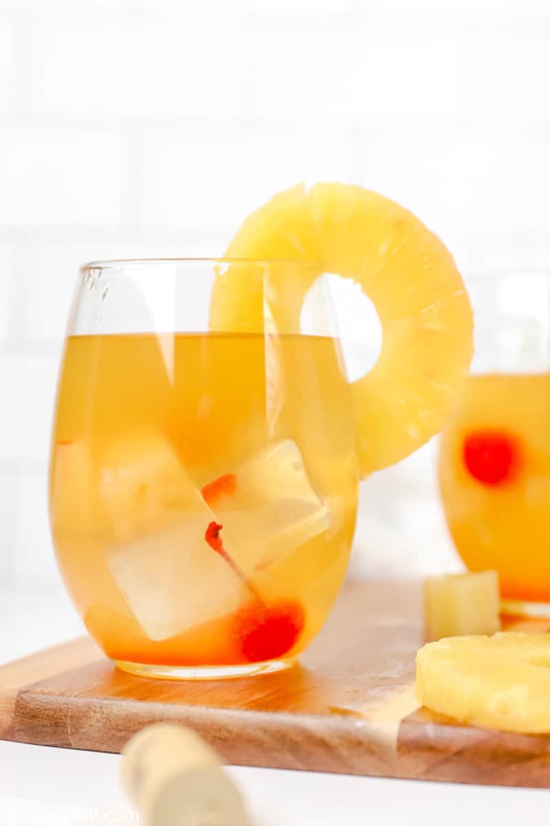 pineapple white wine sangria garnished with fresh pineapple ring