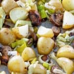 roasted leeks, new potatoes, and mushrooms on a sheet pan