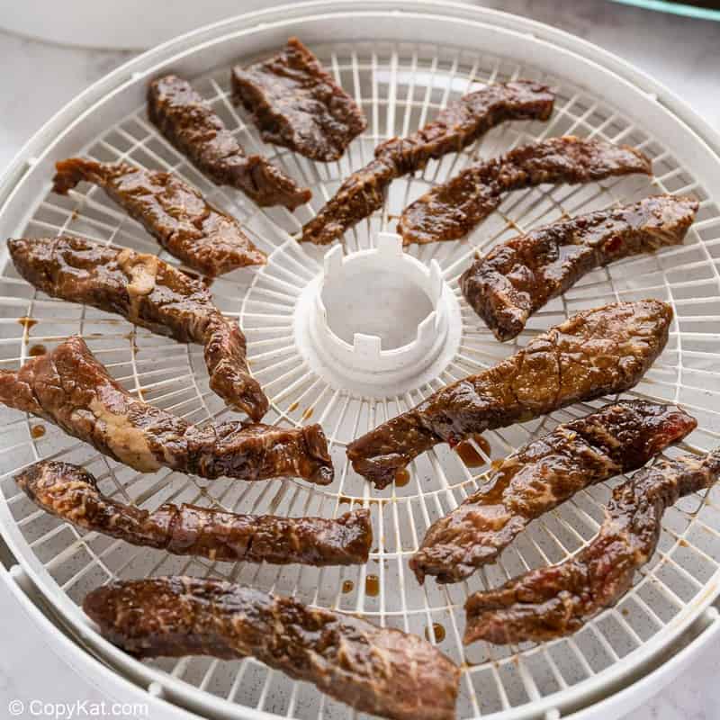 homemade teriyaki beef jerky in a dehydrator