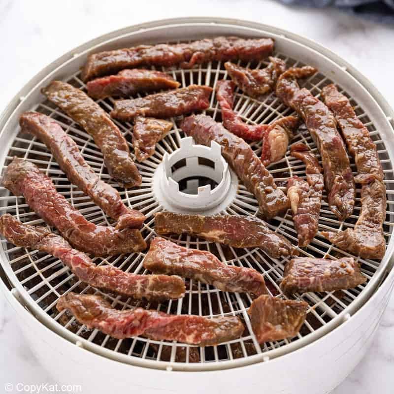 teriyaki marinated beef strips in a food dehydrator