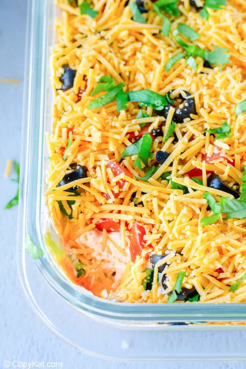 Seven layer dip in a serving dish