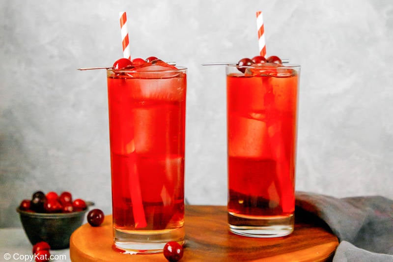 two homemade Ruby Tuesday Killer Kool Aid cocktails and cherries