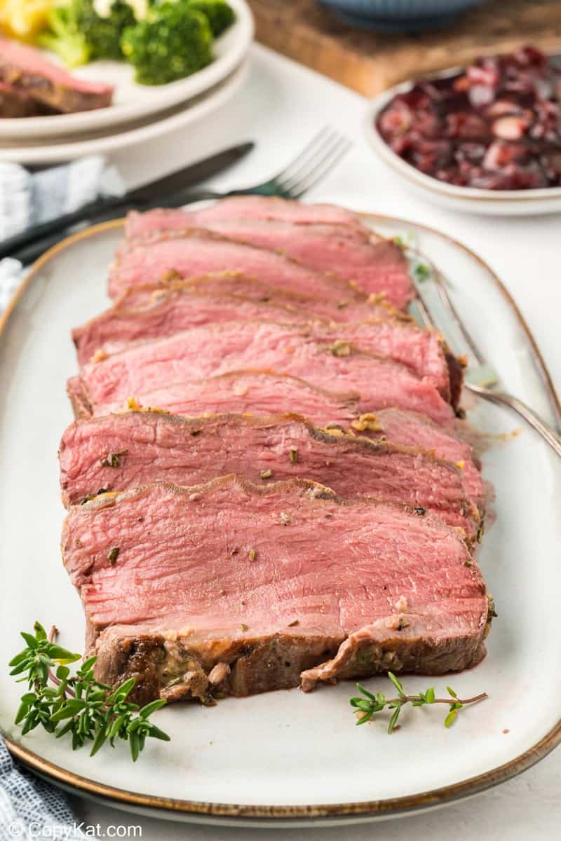 slices of New York strip roast on a platter