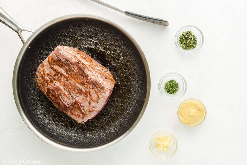 seared New York strip roast in a skillet