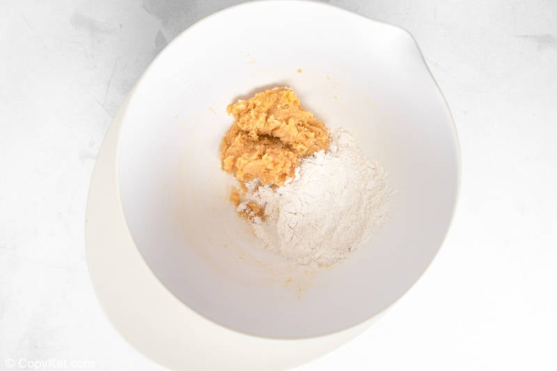 peanut butter cookie dough ingredients in a mixing bowl
