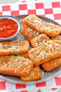 copycat TGI Friday's Fried Mozzarella Sticks and marinara sauce on a platter