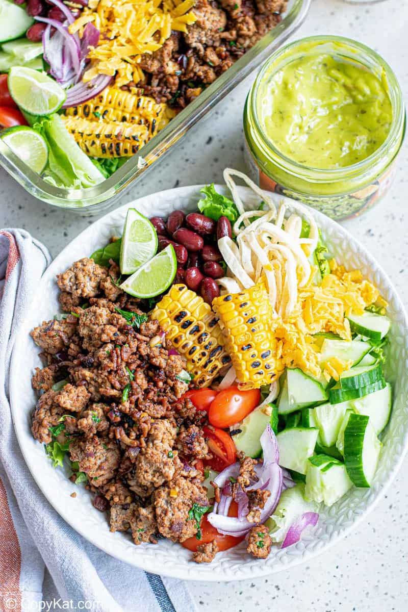 overhead view of a ground beef taco bowl and guacamole