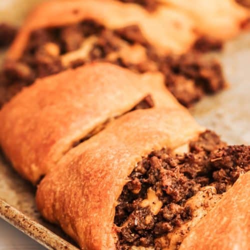 closeup photo of a taco ring on a baking sheet