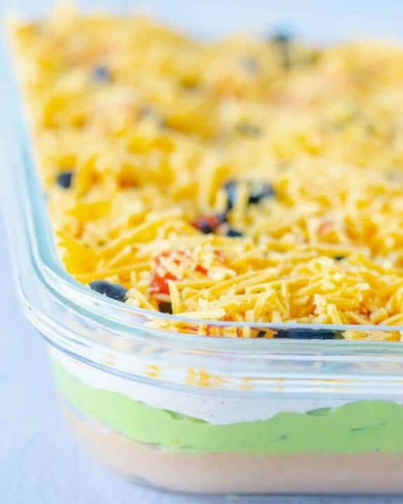 side view of 7 layer dip in a glass serving dish