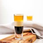 B52 shot on a wood board with a cloth napkin behind it