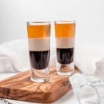 two B52 shots on a wood board