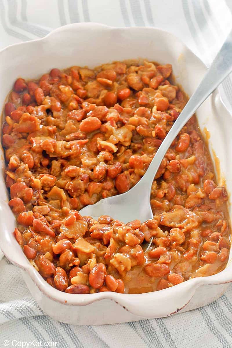 barbecue baked beans and a spoon in a serving dish