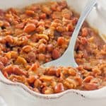 BBQ baked beans and a spoon in a serving dish