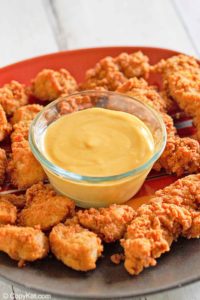 homemade Chick Fil A sauce and chicken nuggets on a platter