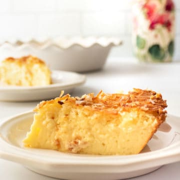 a slice of coconut custard pie on a plate